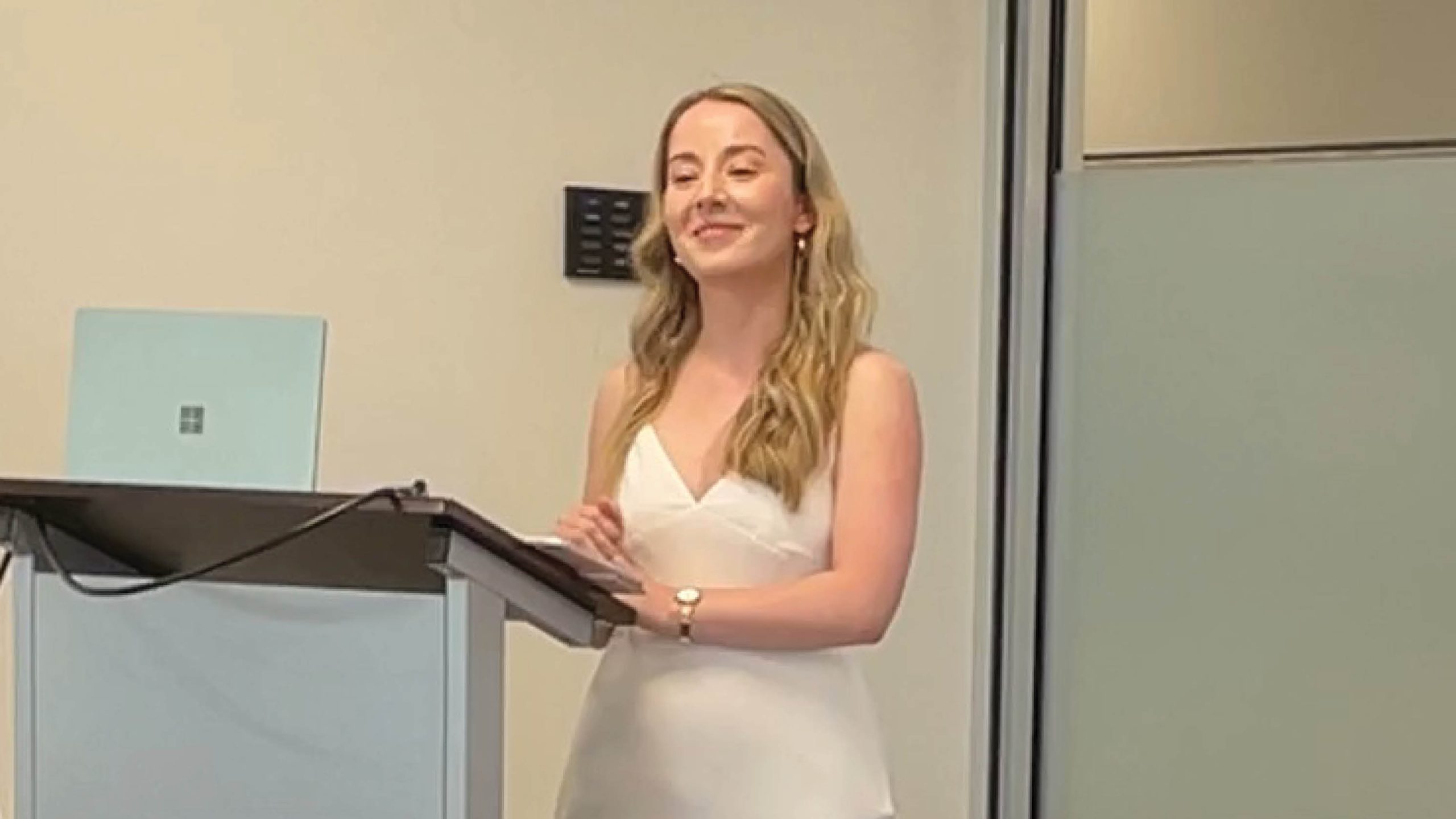 Student giving a presentation at a podium